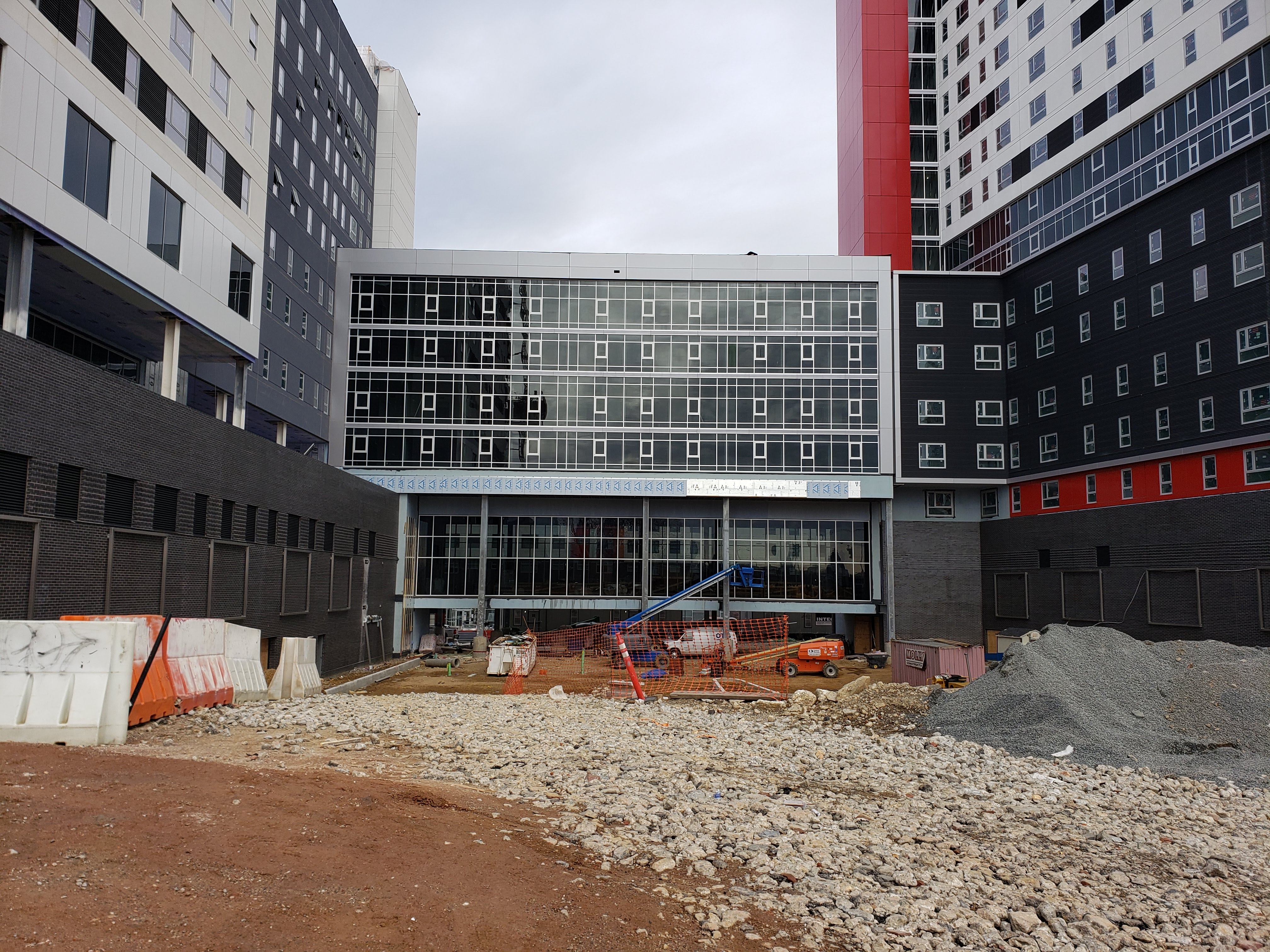 Mid-construction building exterior with curtainwall storefront
