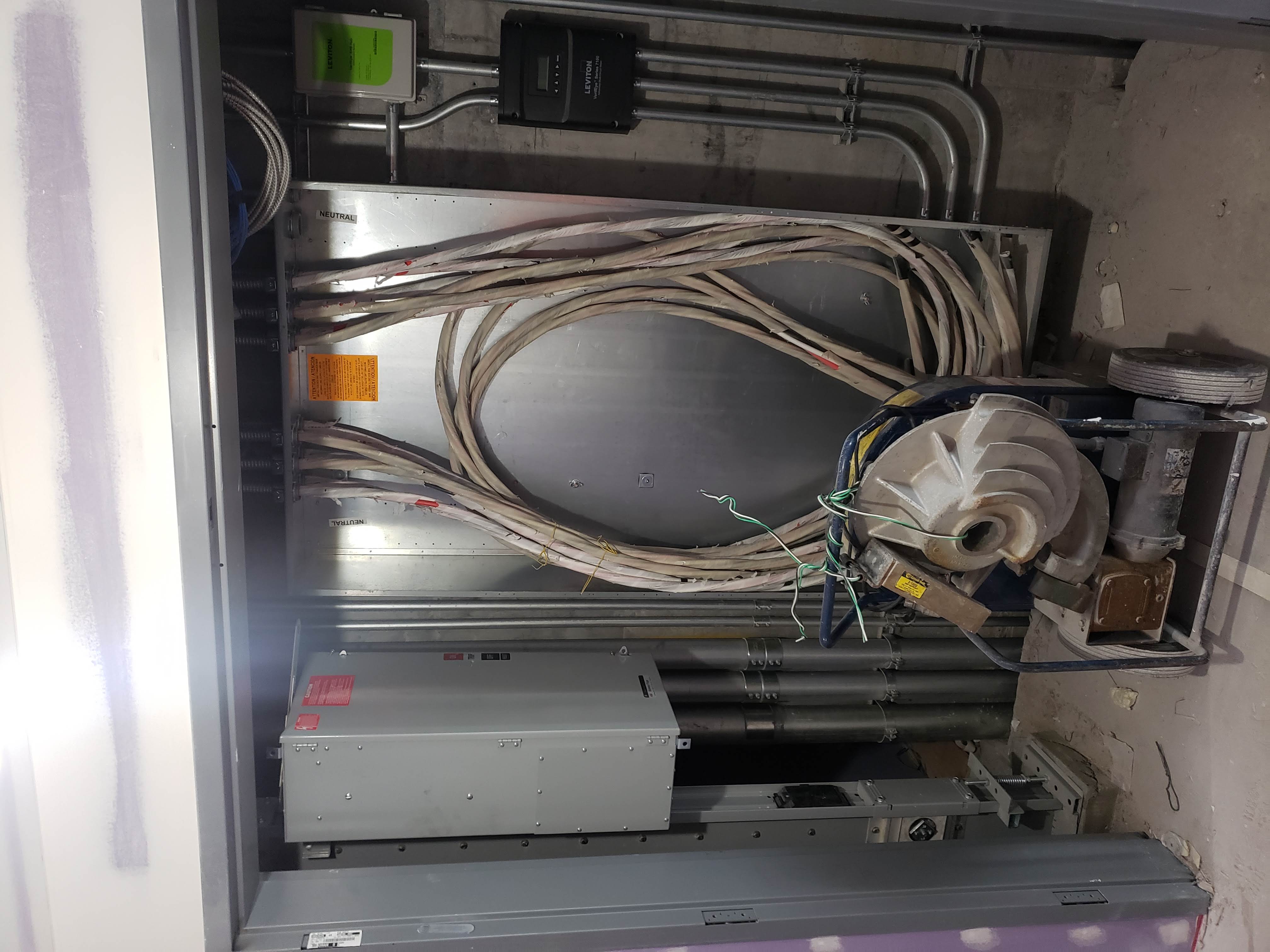 Electrical room with large feeder cables and Leviton meter