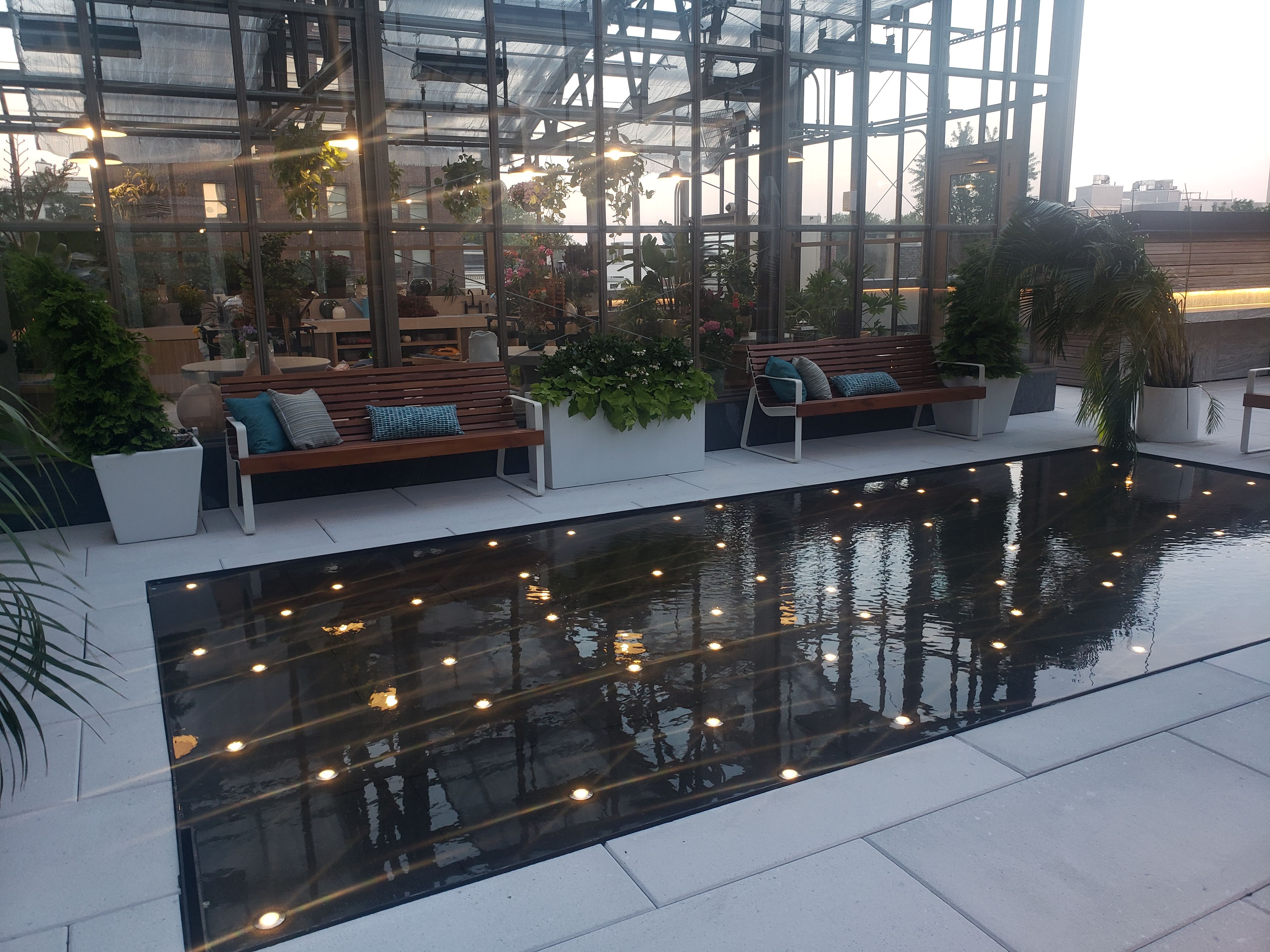 Rooftop reflecting pool with submersible LED puck lights