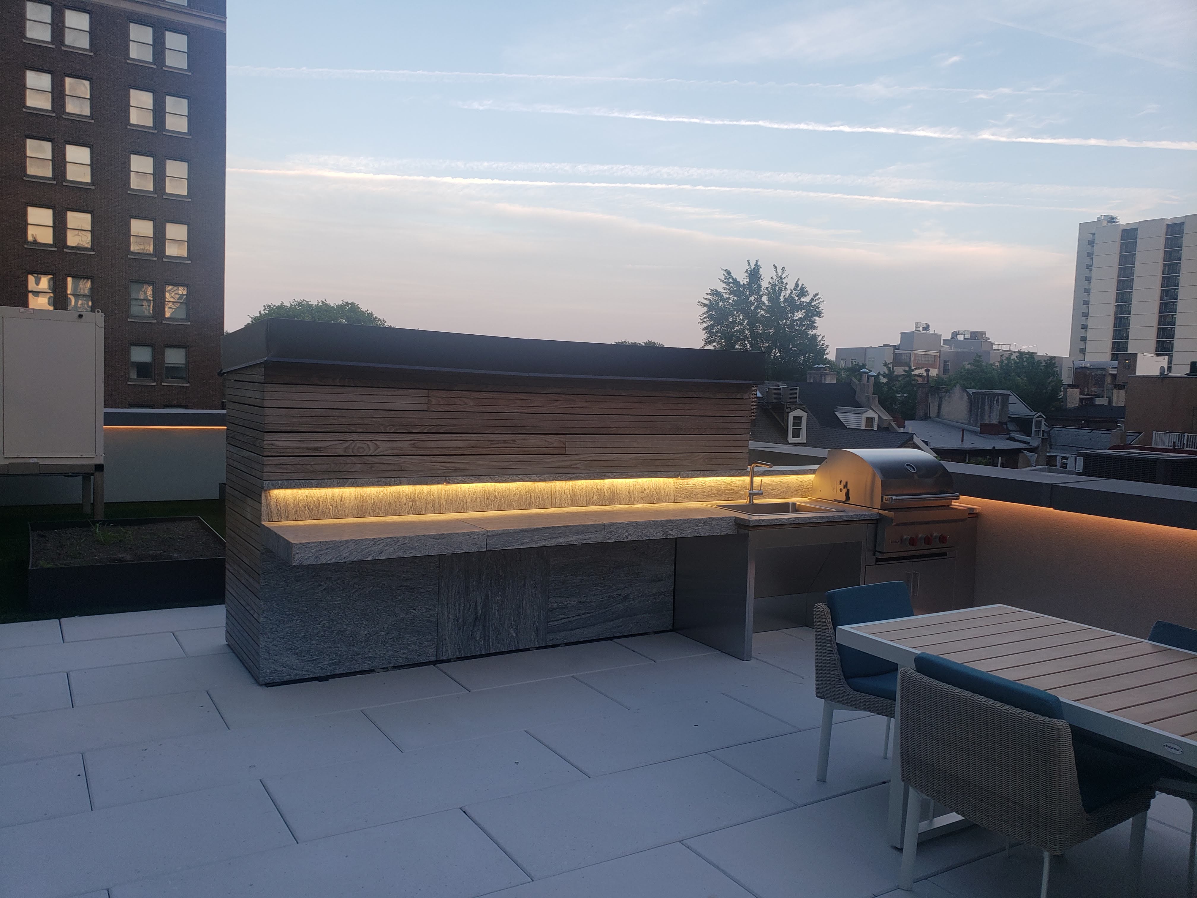 Rooftop outdoor kitchen with LED strip underlighting
