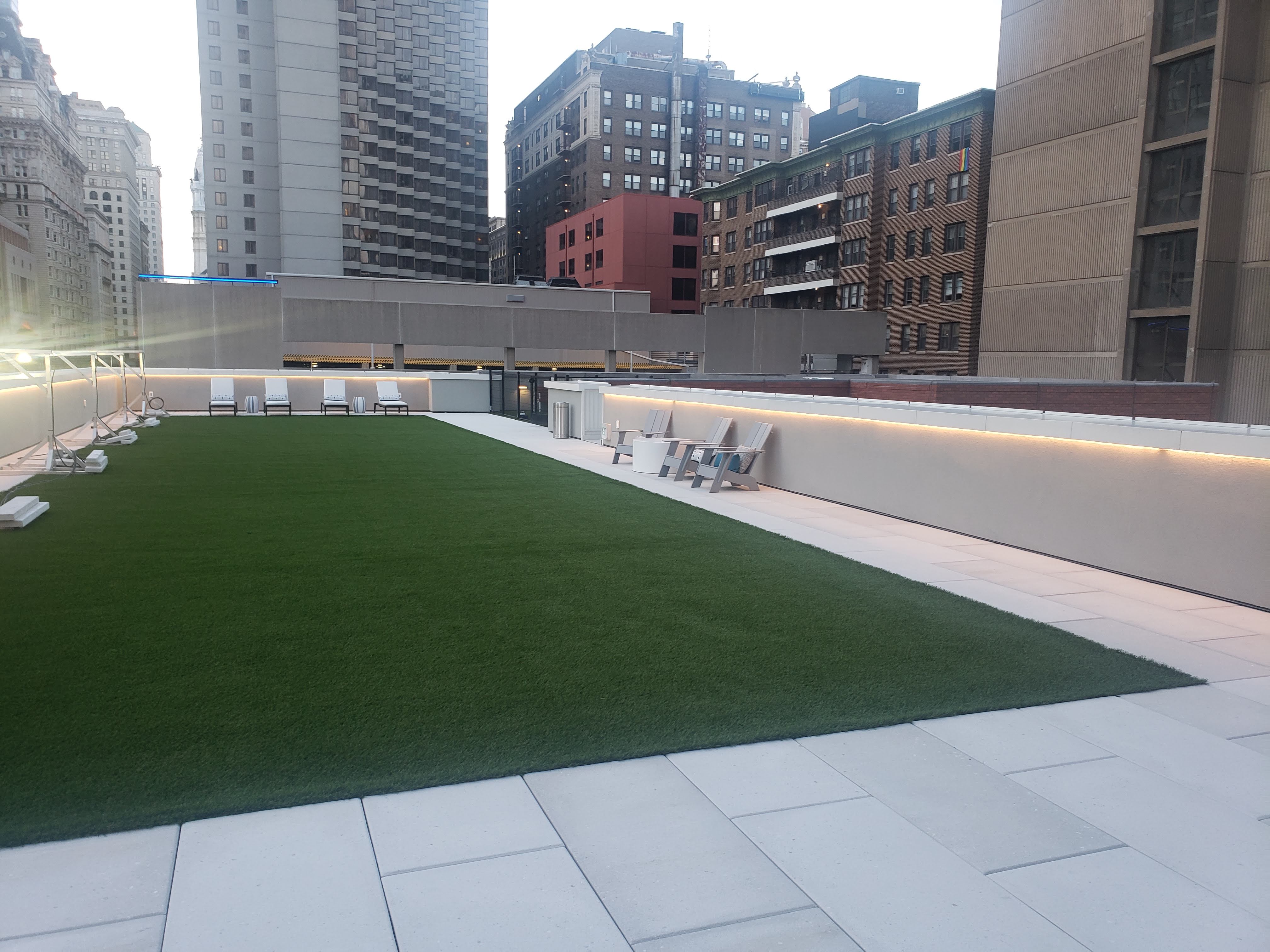 Rooftop terrace with LED cove lighting and Center City skyline