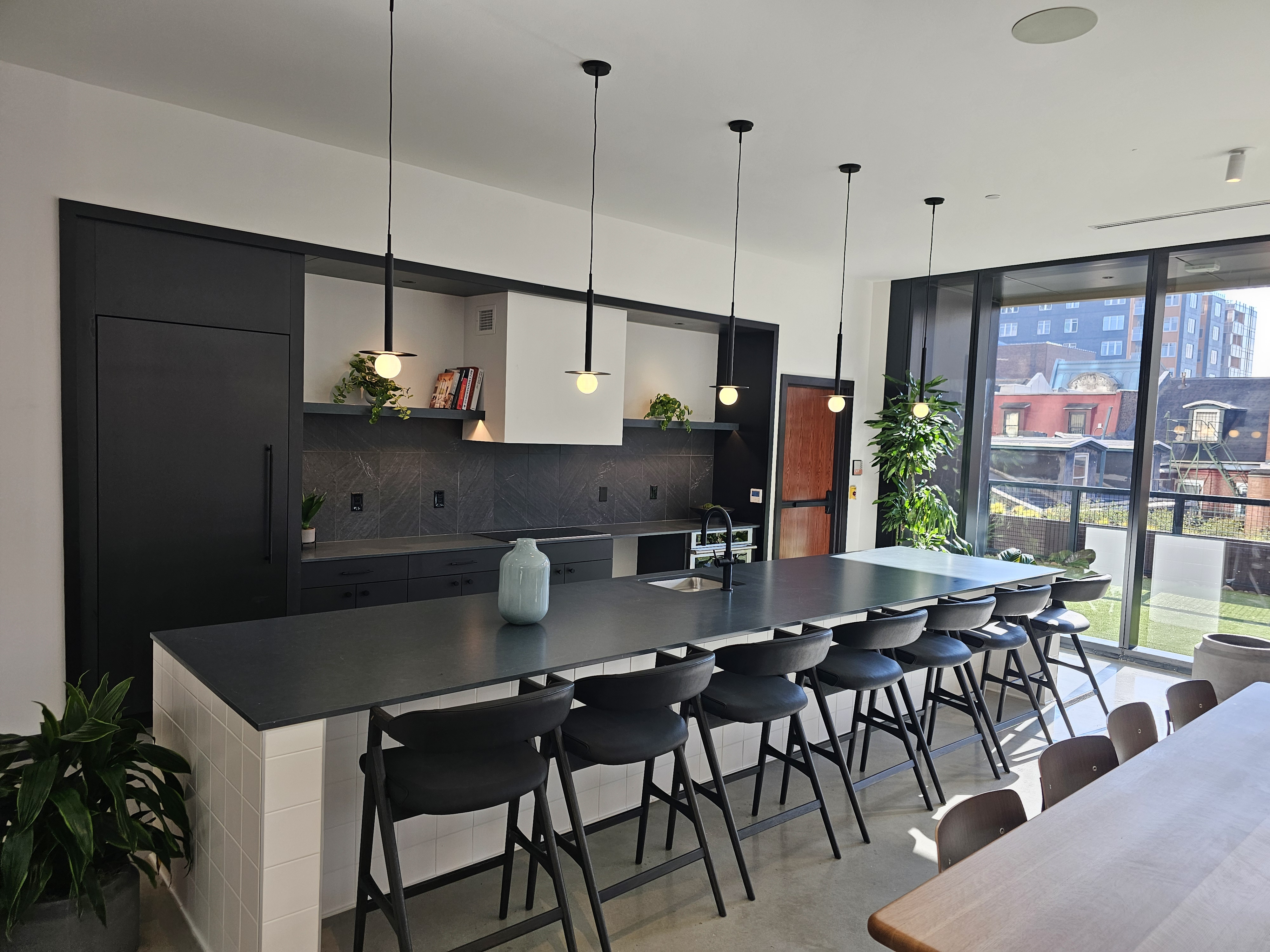 Modern amenity kitchen with globe pendants